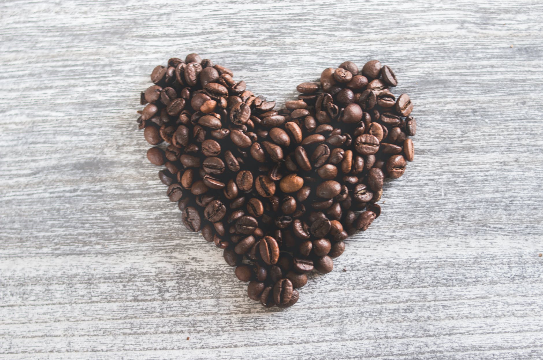 flatlay photo of heart shaped coffee beans